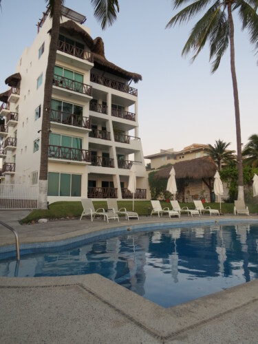 Front view of pool area and building.